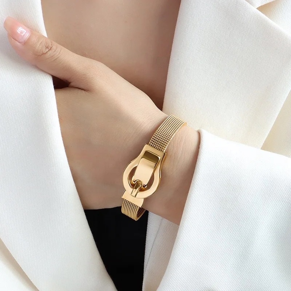Adjustable stainless steel gold-tone bracelet. Also available in silver-tone.